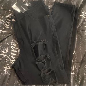 black high-waisted distressed skinny jeans